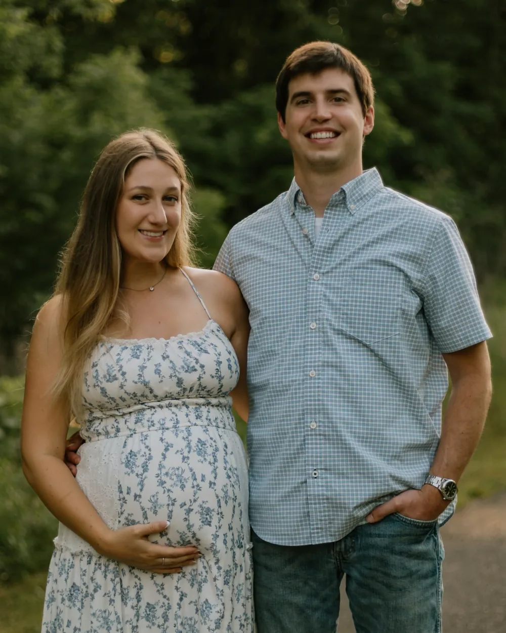 Jordan Darby and his wife, expecting their first child, at a maternity photoshoot in Northwest Arkansas