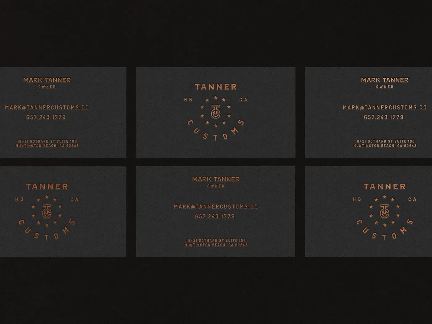 Tanner Customs copper-foil business cards with badge emblem